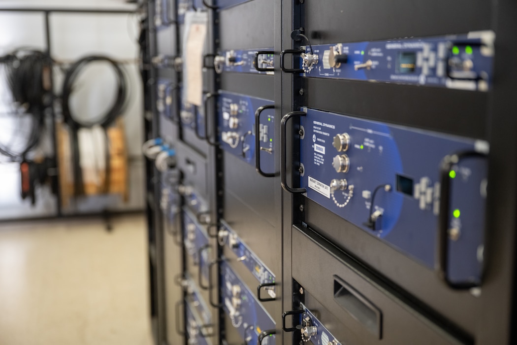 Communications equipment racks inside the Ground Air Transmit Receive site control center are shown at Altus Air Force Base, Oklahoma, March 30, 2026. The system provided secure communications and satellite connectivity to support stateside training, coordination and mission operations. (This photo has been modified for security reasons.) (U.S. Air Force photo by Airman 1st Class Nathan Langston)