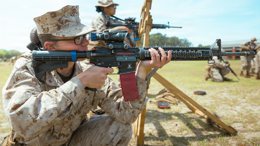 Rct. Izabela Lesinski, a recruit with Golf Company, 2nd Recruit Training Battalion, practices sighting in on Marine Corps Recruit Depot Parris Island, S.C., April 8, 2026. During Grass Week, recruits learn and test on rifle operation and usage with and without barricades in preparation for the Entry Level Rifle Qualification the next week. (U.S. Marine Corps photo by Lance Cpl. Ayden Cassano)