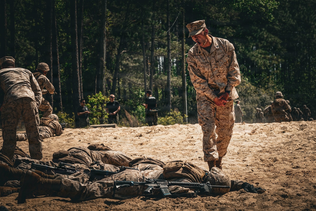 U.S. Marine Corps Sgt. Xavier Perez, a drill instructor with Fox Company, 2nd Recruit Training Battalion, Recruit Training Regiment, instructs recruits during the day movement course on Marine Corps Recruit Depot Parris Island, S.C., April 1, 2026. During Basic Warrior Training week, recruits are taught how to operate, strategize, and maneuver in a field environment. (U.S. Marine Corps photo by Cpl. Jordy Morales)