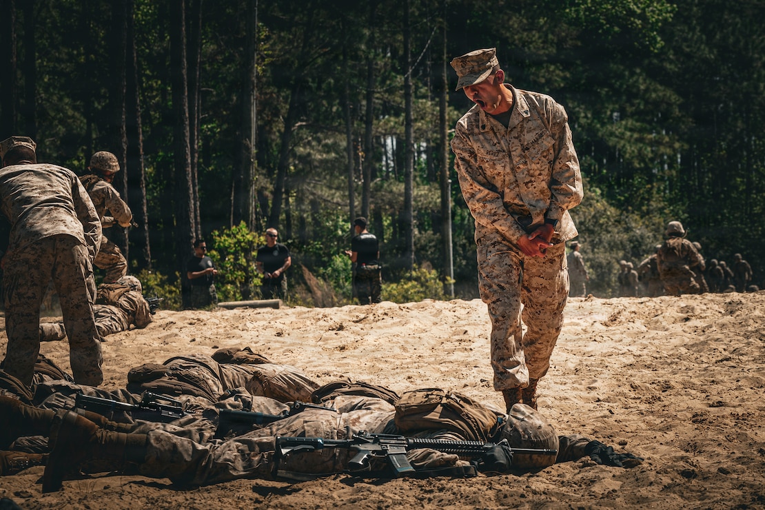 U.S. Marine Corps Sgt. Xavier Perez, a drill instructor with Fox Company, 2nd Recruit Training Battalion, Recruit Training Regiment, instructs recruits during the day movement course on Marine Corps Recruit Depot Parris Island, S.C., April 1, 2026. During Basic Warrior Training week, recruits are taught how to operate, strategize, and maneuver in a field environment. (U.S. Marine Corps photo by Cpl. Jordy Morales)