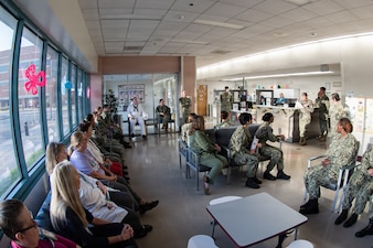 The staff of the Patient Centered Medical Home at Navy Medicine Readiness Training Command Cherry Point conduct their morning safety huddle Thursday, April 2, 2026.  The staff, a mixture of active-duty Sailors and civilians, cares for the spouses and children of Sailors and Marines stationed at MCAS Cherry Point, helping them remain focused on training and preparing for deployment.