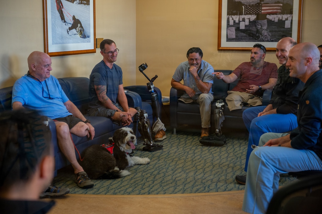 U.S. Navy Capt. Yan Tomas Ortiz-Pomales, plastic surgeon, and Cmdr. James Flint, orthopedic surgeon, engage in discussion with patients during an osseointegration surgery clinical experience lab at Naval Medical Center San Diego, Feb. 25. Osseointegration surgery is a technique where a metal implant is integrated into the patient’s bone, allowing for direct attachment of a prosthesis without the need for a socket. (U.S. Navy photo by Mass Communication Specialist Seaman Jason Afable)