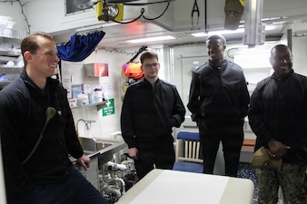 260306-N-OV429-2001 NEWPORT, R.I. (March 6, 2026) – Sailors from Navy Medicine Readiness and Training Command (NMRTC) New England, tour the sick bay onboard the future Arleigh Burke-class guided missile destroyer USS Harvey C. Barnum Jr. (DDG 124), March 6, 2026. The tour highlighted the vital role Navy Medicine plays in sustaining warfighter readiness at sea, reinforcing how medical Sailors contribute directly to mission success. NMRTC New England provides operational training to healthcare professionals through healthcare delivery to optimize both medical staff and Warfighter and readiness. (U.S. Navy photo by Hospital Corpsman Third Class Jammel Tilley)