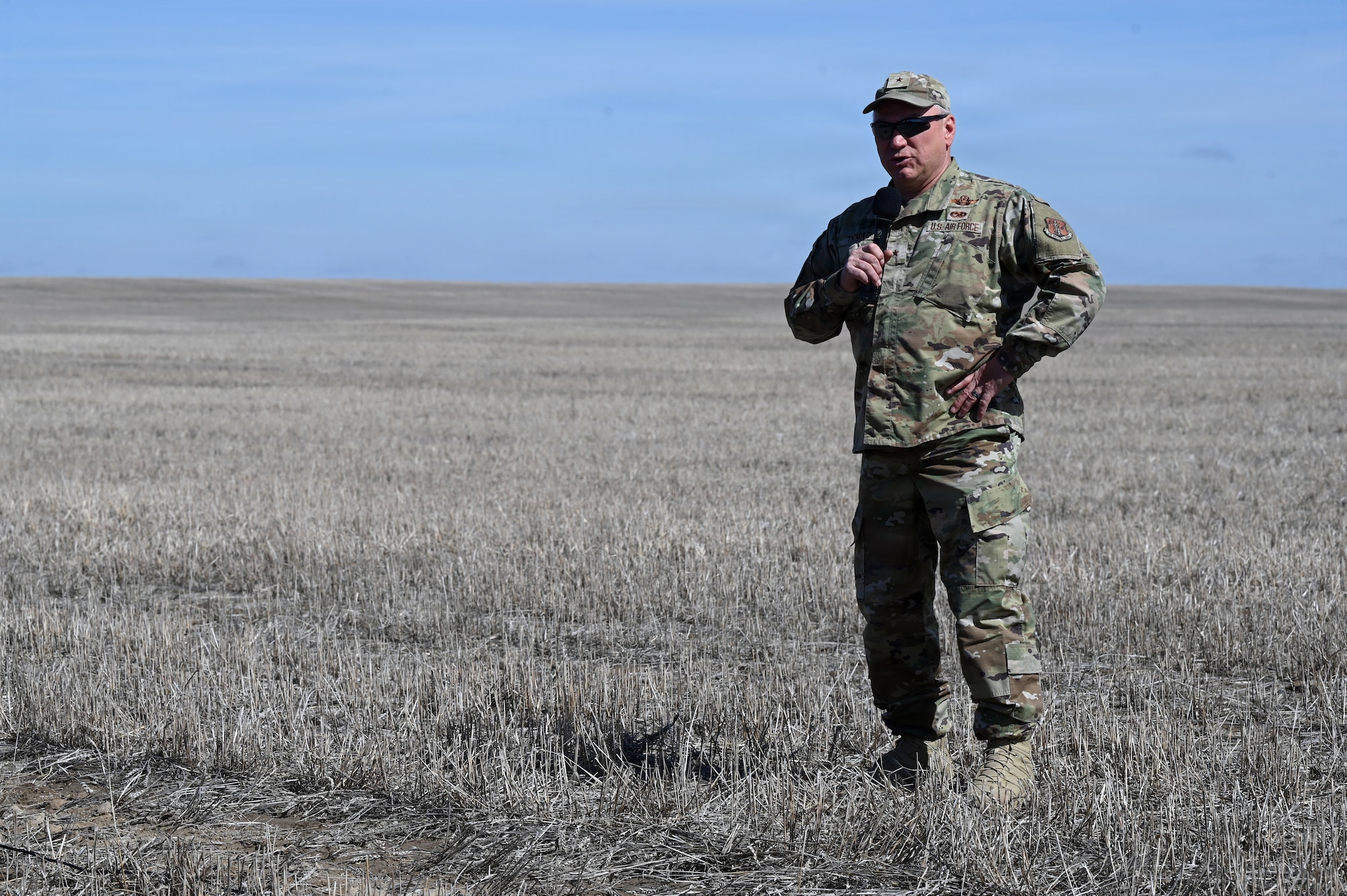 Brig. Gen. Trace N. Thomas, Montana’s Assistant Adjutant General-Air, addresses attendees during an aerial delivery demonstration at the Vigilante Drop Zone near Power, Montana, April 6, 2026.