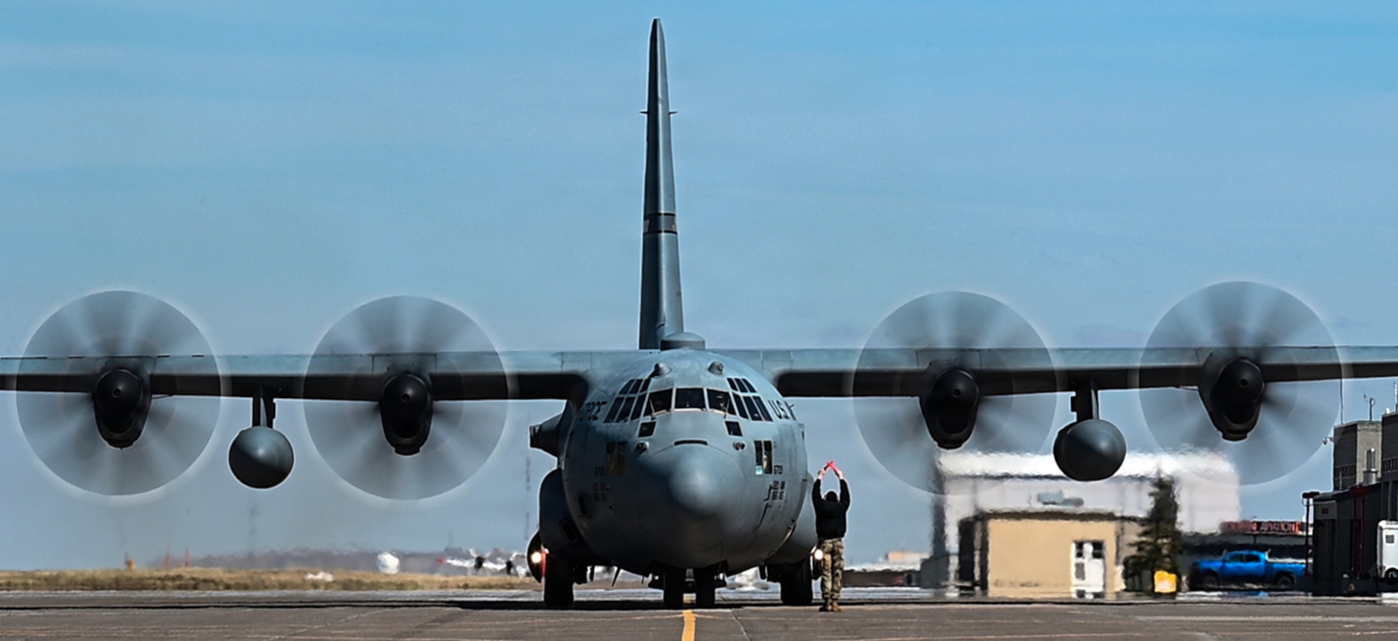 A U.S. Air Force C-130 aircraft assigned to the 120th Airlift Wing taxis on the flight line following an aerial delivery mission supporting training at the Vigilante Drop Zone near Great Falls, Montana, April 6, 2026.