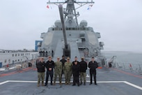 260306-N-OV429-2003 NEWPORT, R.I. (March 6, 2026) – Sailors from Navy Medicine Readiness and Training Command (NMRTC) New England, stand together following a tour onboard the future Arleigh Burke-class guided missile destroyer USS Harvey C. Barnum Jr. (DDG 124), March 6, 2026. The tour highlighted the vital role Navy Medicine plays in sustaining warfighter readiness at sea, reinforcing how medical Sailors contribute directly to mission success. NMRTC New England provides operational training to healthcare professionals through healthcare delivery to optimize both medical staff and Warfighter and readiness. (U.S. Navy photo by Hospital Corpsman Third Class Jammel Tilley)
