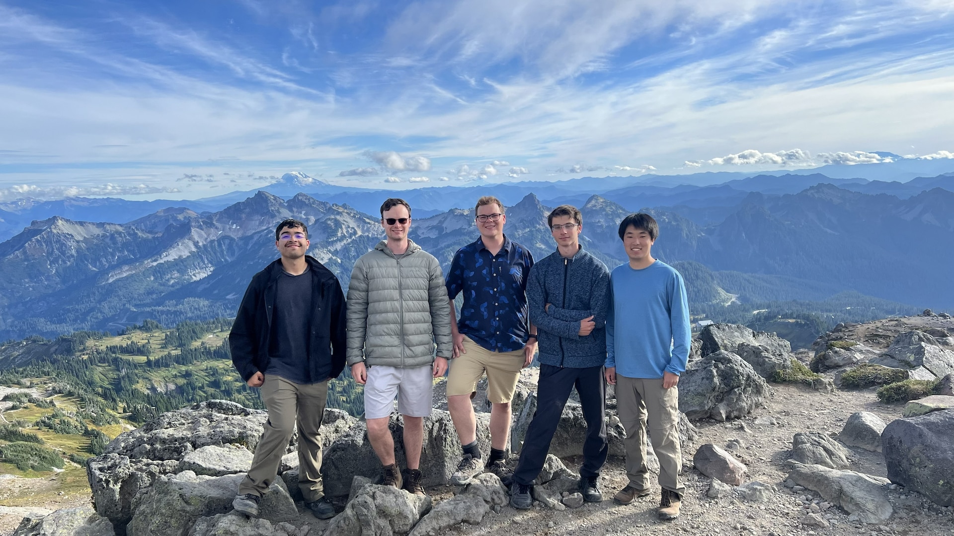 Team members supporting robotic and autonomous systems development at Naval Surface Warfare Center Carderock Division pose during a field event. Left to right: Daniel Hernandez (former team member), William Gottwald, Eric Lethin, Theo Winter, and Joshua Choe. Not pictured: Christopher Nunes and Zachery Birkbeck.