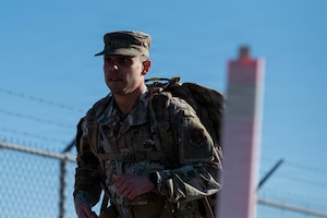U.S. Air Force Senior Master Sgt. Mark Barnabas, Commander's Support Staff superintendent assigned to the 161st Air Refueling Wing, jogs during the ruck march portion of the German Armed Forces Proficiency Badge assessment at Goldwater Air National Guard Base, Phoenix, April 3, 2026. The GAFPB is a decoration of the Bundeswehr, the Armed Forces of the Federal Republic of Germany, and is one of few foreign military badges authorized to be worn by U.S. Air Force, Army, and Space Force members.  (U.S. Air National Guard photo by Airman 1st Class Jacob Hreshchyshyn)