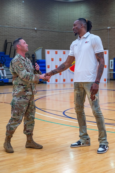 U.S. Air Force Col. Darryl Hebert (left), 56th Mission Support Group commander, greets Dwight Howard (right), former NBA player, April 2, 2026, at Luke Air Force Base, Arizona.