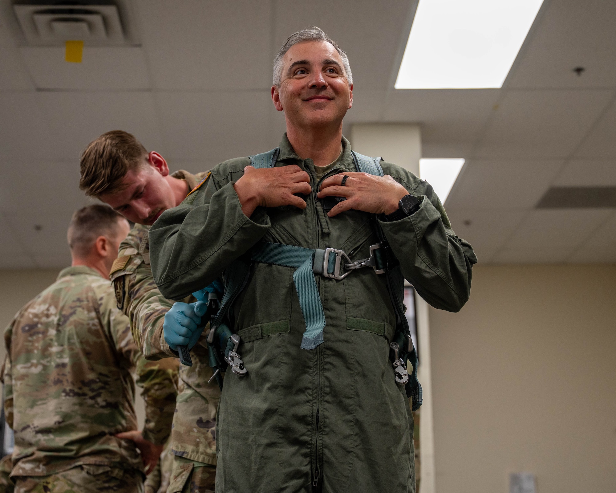 U.S. Air Force Chief Master Sgt. Shawn M. Aiello, Air Force Global Strike Command command chief, is fitted with a flight harness by an aircrew flight equipment technician at Dyess Air Force Base, Texas, March 30, 2026. The fitting took place ahead of a B-1B Lancer training flight, where Aiello experienced firsthand why the B-1 is the backbone of America’s penetrating long-range bomber force (U.S. Air Force photo by Airman 1st Class William Neal)