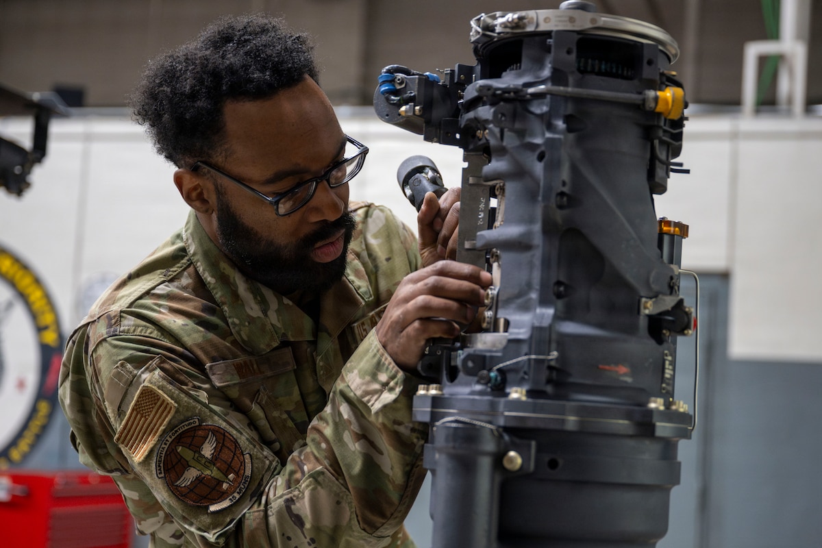 U.S. Air Force Staff Sgt. Quantavious Wall, 35th Munitions Squadron armament floor supervisor, examines an F-16 Fighting Falcon’s M6A1 Vulcan rotary cannon at Misawa Air Base, Japan, March 31, 2026.