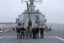 260306-N-OV429-2003 NEWPORT, R.I. (March 6, 2026) – Sailors from Navy Medicine Readiness and Training Command (NMRTC) New England, stand together following a tour onboard the future Arleigh Burke-class guided missile destroyer USS Harvey C. Barnum Jr. (DDG 124), March 6, 2026. The tour highlighted the vital role Navy Medicine plays in sustaining warfighter readiness at sea, reinforcing how medical Sailors contribute directly to mission success. NMRTC New England provides operational training to healthcare professionals through healthcare delivery to optimize both medical staff and Warfighter and readiness. (U.S. Navy photo by Hospital Corpsman Third Class Jammel Tilley)