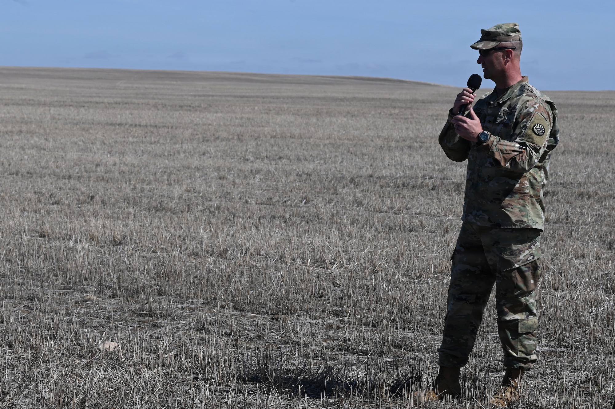 Brig. Gen. Trenton J. Gibson, Montana’s Adjutant General, addresses attendees during an aerial delivery demonstration at the Vigilante Drop Zone near Power, Montana, April 6, 2026.