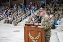 Chief Master Sergeant of the Air Force David R. Wolfe addresses Airmen as the guest speaker during a coin and retreat ceremony at Joint Base San Antonio-Lackland.