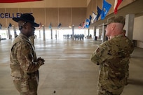 Technical Sgt. Arlen Wiley, Military Drill and Ceremonies NCO, gives Chief Master Sergeant of the Air Force David R. Wolfe a tour of the 323rd Training Squadron