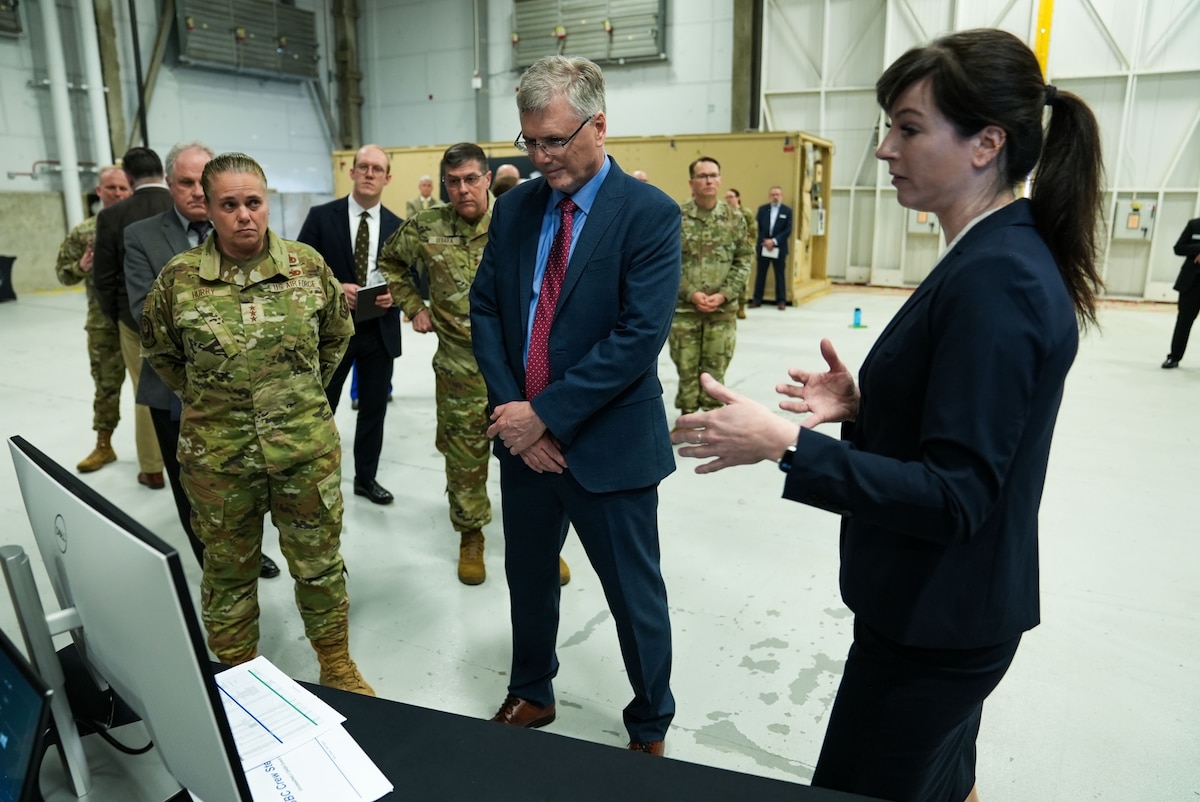 three people taking a briefing