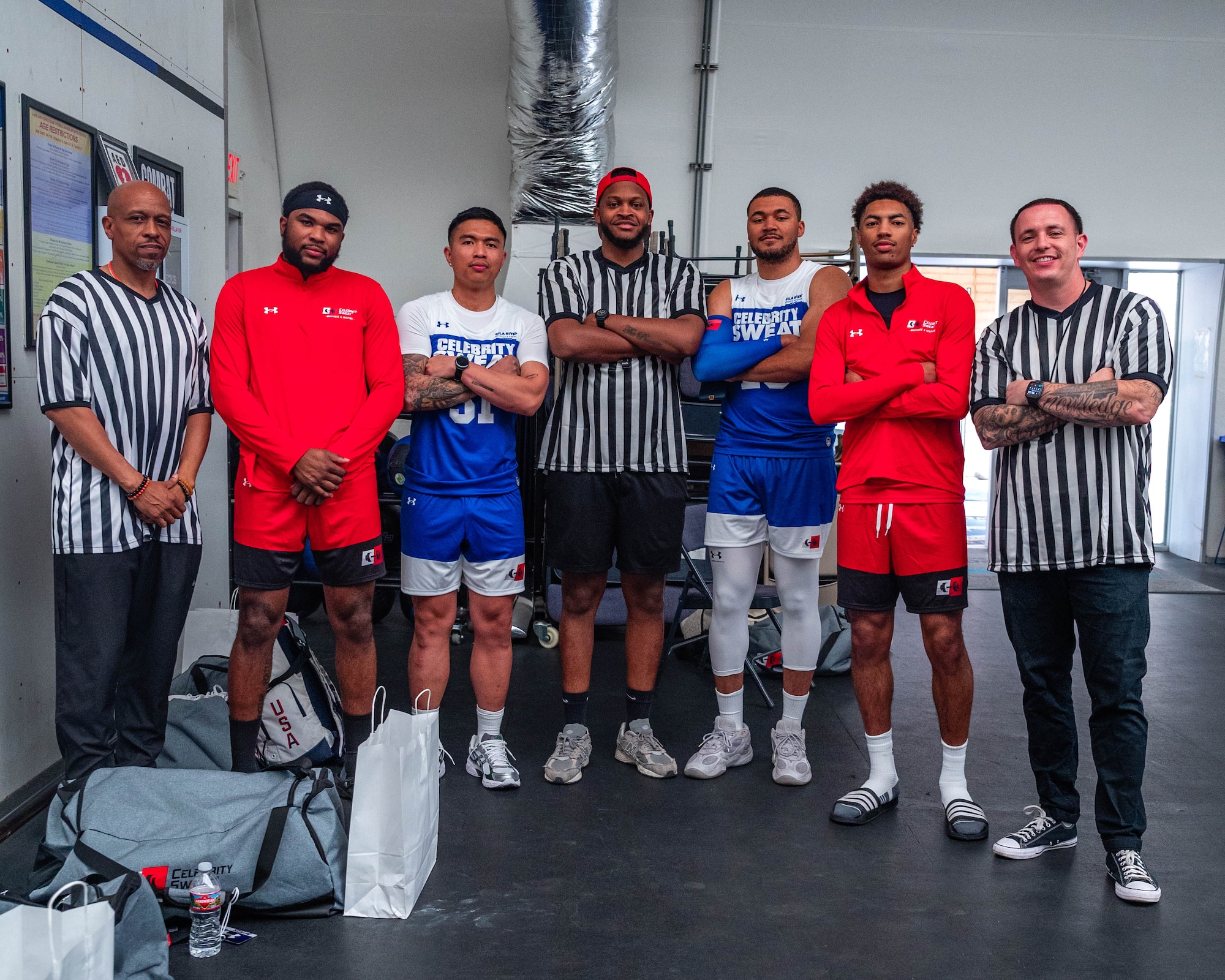 U.S. Air Force Airmen assigned to the 56th Fighter Wing, pose for a photo prior to Celebrity Slam Jam, April 2, 2026, at Luke Air Force Base, Arizona.