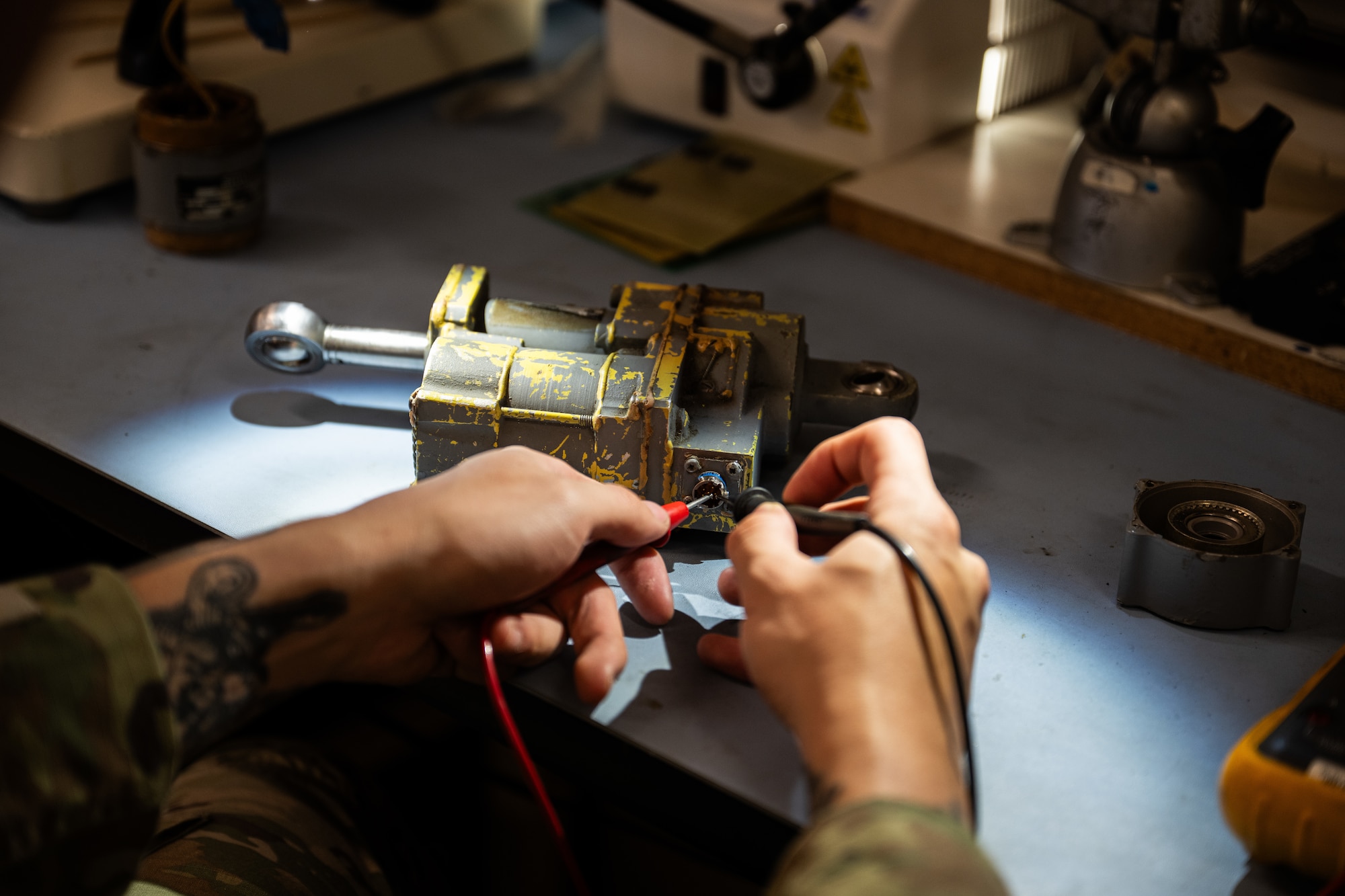 U.S. Air Force Senior Airman Kole Gieseke, 7th Maintenance Group Air Force Repair Enhancement Program technician, tests a seat actuator at Dyess Air Force Base, Texas, March 23, 2026. AFREP enables Airmen to repair parts that are non-serviceable or coded for disposal, returning them to the supply system or sending them to approved U.S. based repair facilities when required. (U.S. Air Force photo by Airman 1st Class Caleb Schellenberg)