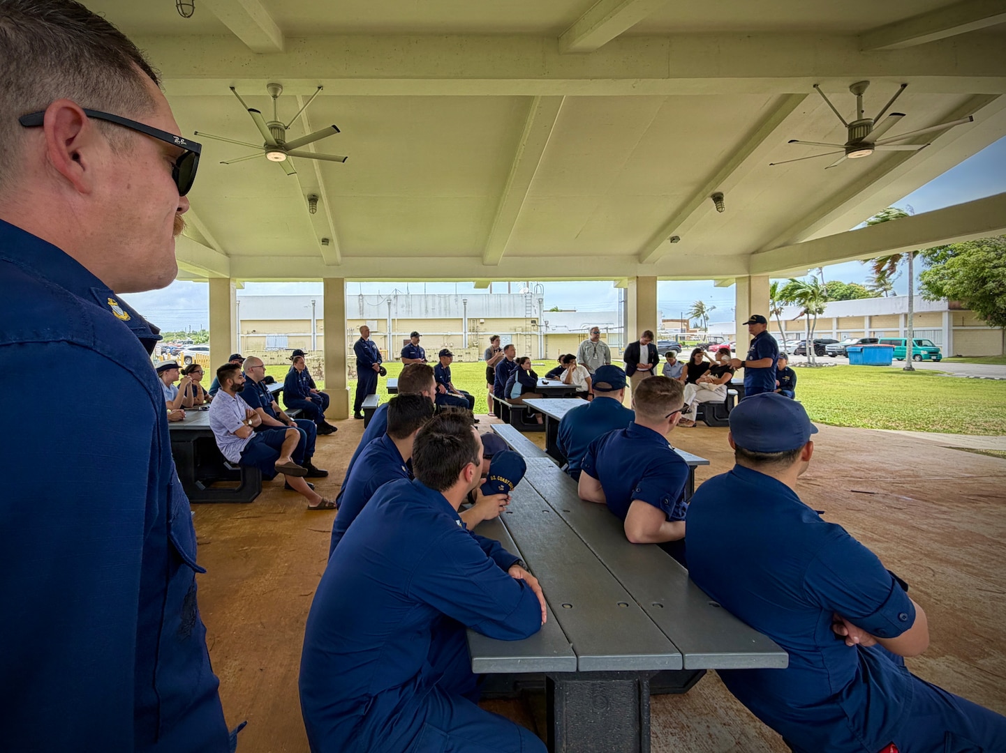 Members of U.S. Coast Guard Forces Micronesia/Sector Guam hold all hands to discuss storm preparations on April 10, 2026, ahead of storm Sinlaku. The U.S. Coast Guard is coordinating with the National Weather Service, Guam Homeland Security/Office of Civil Defense, Commonwealth of the Northern Mariana Islands Office of Homeland Security and Emergency Management, and local and federal partners as part of a unified One Marianas response. (U.S. Coast Guard photo by Chief Warrant Officer Sara Muir)