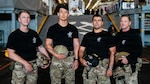 The U.S. Navy dive medical team with Explosive Ordnance Disposal Group ONE (EODGRU-1) pose for a group photo while underway on Amphibious transport dock ship USS John P. Murtha (LPD 26) in the Pacific Ocean, April 9, 2026. John P. Murtha is underway in the U.S. 3rd Fleet area of operations supporting NASA’s Artemis II mission, retrieving the crew and spacecraft following their return to Earth and splashdown in the Pacific Ocean. NASA’s Artemis II mission sent four astronauts on a flight around the moon in the Orion space capsule, marking the first time humans journeyed to deep space in over 50 years. (U.S. Navy photo by Mass Communication Specialist 2nd Class August Clawson)