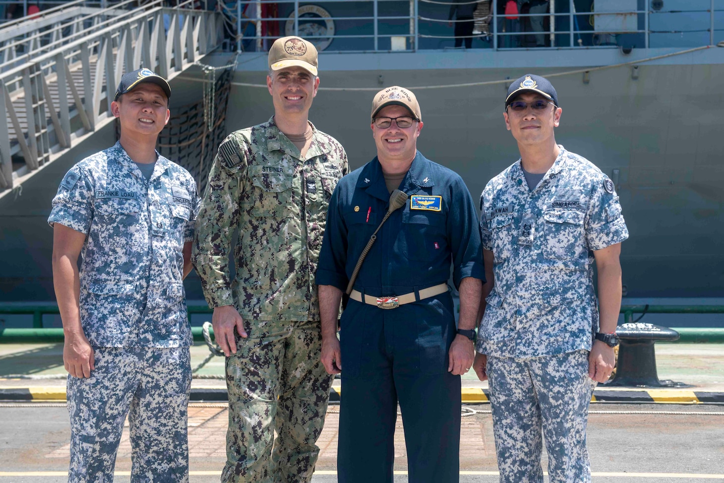 From left: Republic of Singapore Navy (RSN) Maj. Frankie Loau, Commander, Task Force 73 Chief of Staff Capt. Axel Steiner, U.S. 7th Fleet flagship USS Blue Ridge (LCC 19) Commanding Officer Capt. Louis F. Catalina, and ¬RSN Lt. Col. Ivan Kwah, meet following an arrival ceremony for Blue Ridge at Changi Naval Base, Singapore, April 3, 2026.