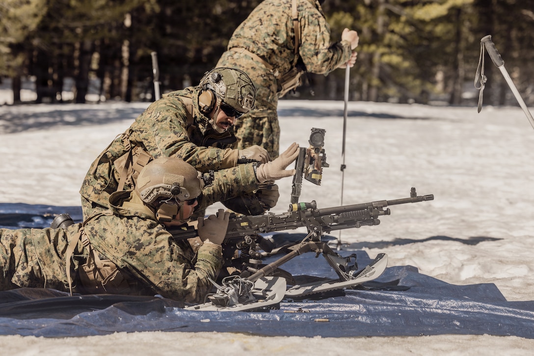 U.S. Marines with Alpha Company 1st Battalion, 2nd Marine Regiment, 2nd Marine Division, load an M240B machine gun during a live-fire unknown distance range as part of Mountain Warfare Training 2-26 on Marine Corps Mountain Warfare Training Center, Bridgeport, California, March 11, 2026. Marines with Alpha Company conducted the range in order to familiarize themselves with weapon sustainment, enhance marksmanship proficiency and increase combat lethality in cold weather, mountainous environments. (U.S. Marine Corps photo by Lance Cpl. Dominic Trujillo)