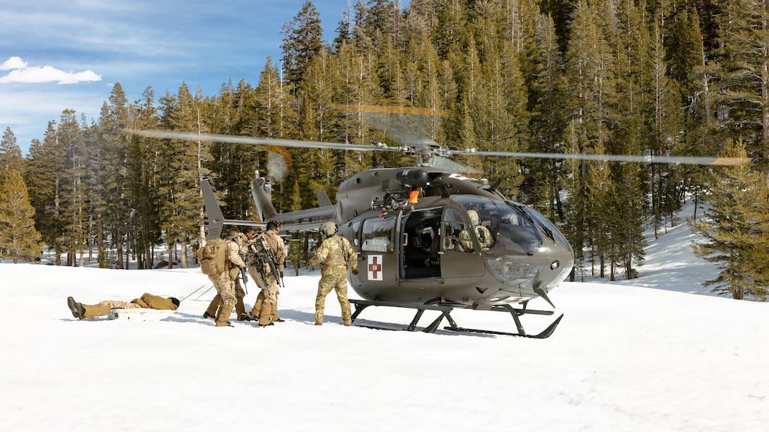 U.S. Marines with Charlie Company, 1st Battalion, 2nd Marine Regiment, 2nd Marine Division, drag a simulated casualty during a simulated casualty evacuation during Mountain Warfare Training Exercise 2-26 on Marine Corps Mountain Warfare Training Center, Bridgeport, California, March 9, 2026. MTX is a one-month-long exercise designed to prepare units to survive and strengthen expeditionary warfare tactics in cold-weather mountainous environments. (U.S. Marine Corps photo by Lance Cpl. Dominic Trujillo)