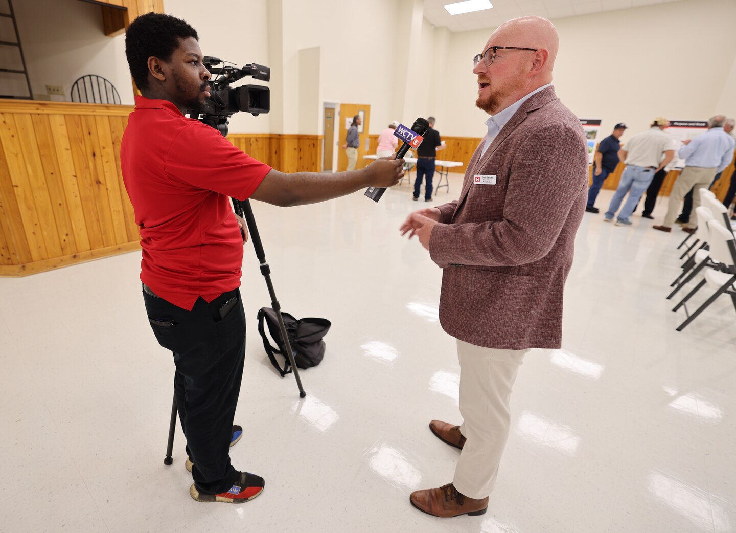 Man being interviewed.