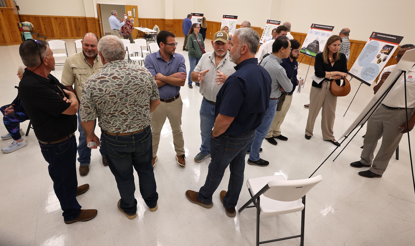 People standing at a group meeting.