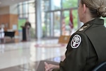 A medical insignia is seen on a uniform as Col. Mark L. Jacques, commander of Carl R. Darnall Army Medical Center, speaks during a 10-year anniversary ceremony at Fort Hood, Texas. The milestone highlights a decade of care supporting Soldiers, Veterans, families, and readiness.