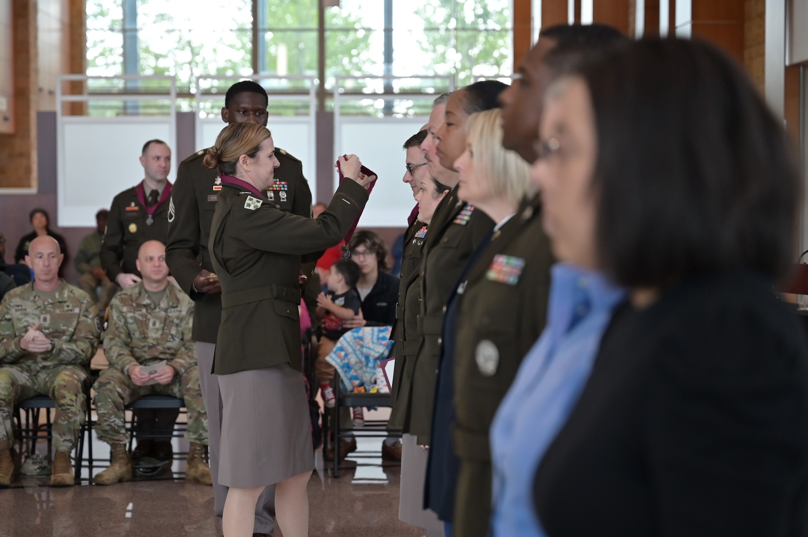 Col. Meghan Raleigh, chief medical officer at Carl R. Darnall Army Medical Center, holds the Order of Military Medical Merit before presenting it during the hospital’s 10-year anniversary ceremony at Fort Hood, Texas. The award recognizes excellence and significant contributions to Army medicine.