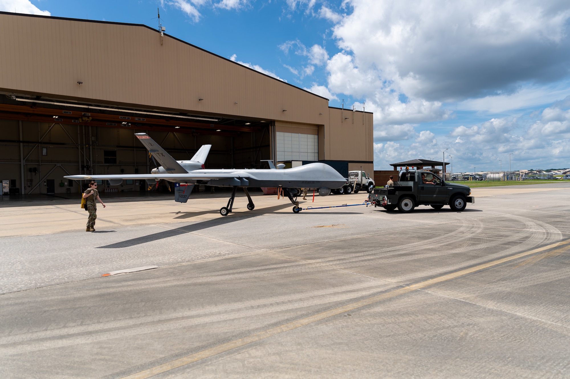 Photo of 116th Airmen and MQ-9 Reaper