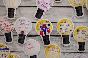 Inspirational quotes on lightbulb sticky notes