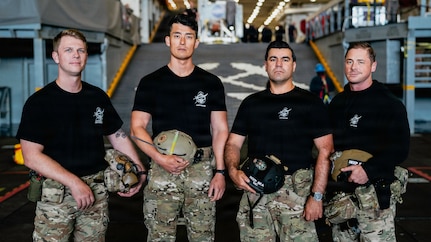 The U.S. Navy dive medical team with Explosive Ordnance Disposal Group ONE (EODGRU-1) pose for a group photo while underway on Amphibious transport dock ship USS John P. Murtha (LPD 26) in the Pacific Ocean, April 9, 2026. John P. Murtha is underway in the U.S. 3rd Fleet area of operations supporting NASA’s Artemis II mission, retrieving the crew and spacecraft following their return to Earth and splashdown in the Pacific Ocean. NASA’s Artemis II mission sent four astronauts on a flight around the moon in the Orion space capsule, marking the first time humans journeyed to deep space in over 50 years. (U.S. Navy photo by Mass Communication Specialist 2nd Class August Clawson)