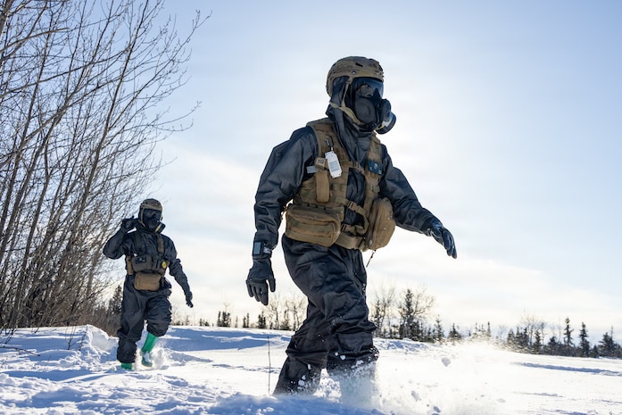 U.S. Marine Corps Cpl. Camron Davis, right, and Cpl. Ian Dunbar, both chemical, biological, radiological and nuclear defense specialists assigned to the Chemical Biological Incident Response Force, execute reconnaissance to locate a target and identify a sample site while conducting cold weather sample training during ARCTIC EDGE 2026 (AE26) near Fort Greely, Alaska, March 5, 2026. AE26 is a North American Aerospace Defense Command (NORAD) and U.S. Northern Command-led homeland defense exercise designed to improve readiness, demonstrate capabilities, and enhance Joint and Allied Force interoperability in the Arctic. (U.S. Marine Corps photo by Lance Cpl. Amy Espinoza)