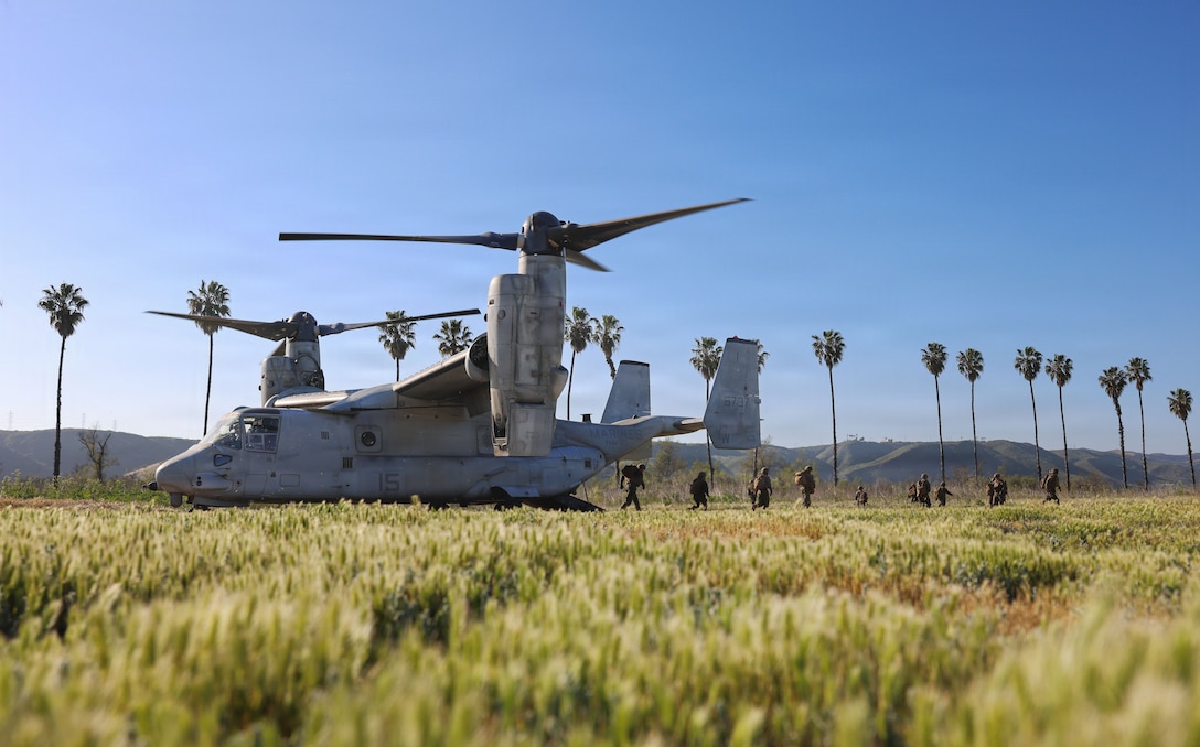 U.S. Marines with 9th Communication Battalion, I Marine Expeditionary Force Information Group, disembark an MV-22B Osprey assigned to Marine Medium Tiltrotor Squadron (VMM) 164, Marine Aircraft Group 39, 3rd Marine Aircraft Wing in support of a deployment readiness air confidence operation conducted at Marine Corps Base Camp Pendleton, California, March 24, 2026. DRACOs enable Marines to enhance combat readiness through aviation movement rehearsals, training, and sustainment, ensuring forces remain prepared to deploy and operate in support of Marine Air-Ground Task Force operations. (U.S. Marine Corps photo by Sgt. Kristin Louise Long)