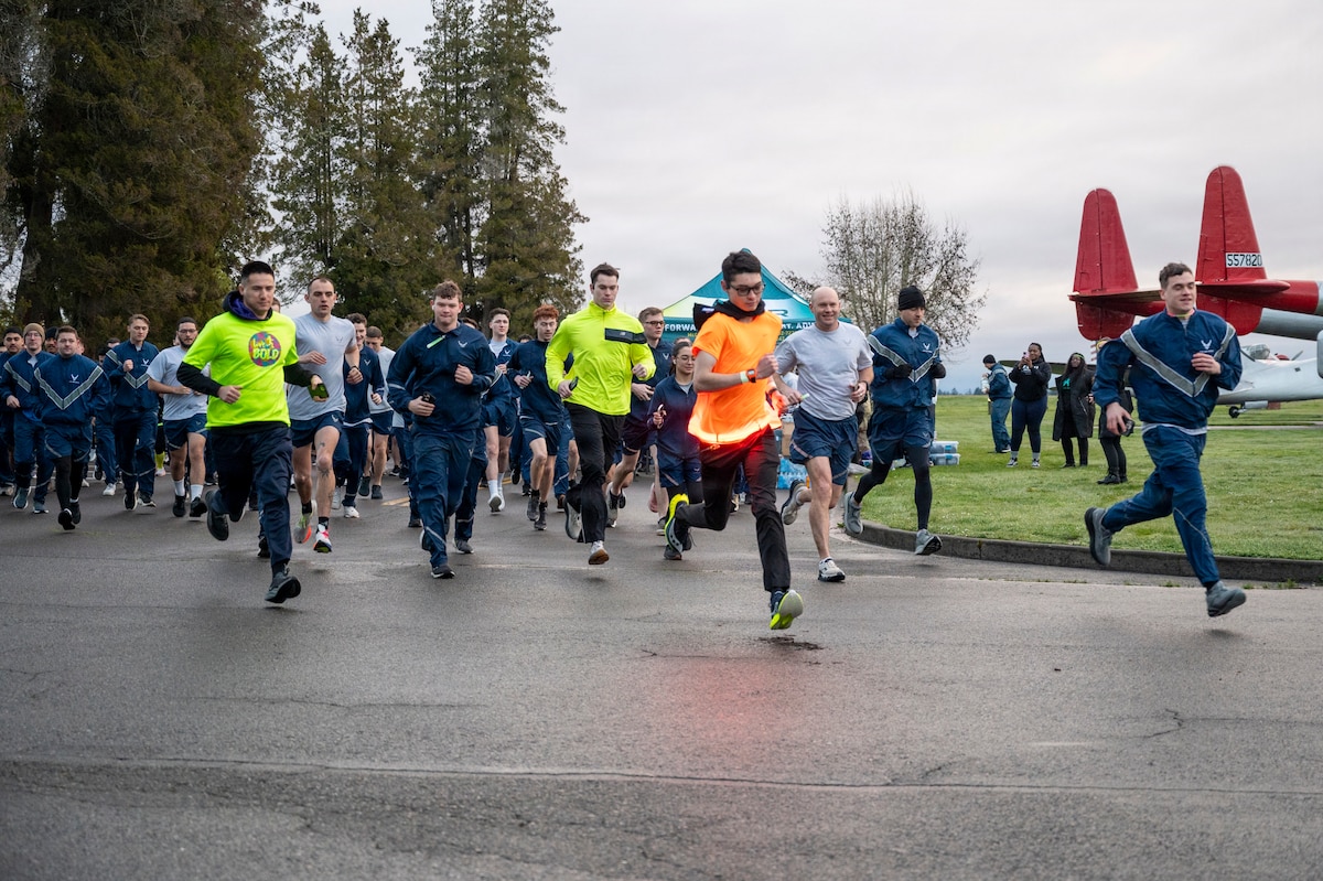 Sexual Assault Awareness and Prevention Month Glow Run 5K participants begin running at Joint Base Lewis-McChord, Washington, April 2, 2025.