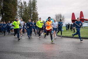 Sexual Assault Awareness and Prevention Month Glow Run 5K participants begin running at Joint Base Lewis-McChord, Washington, April 2, 2025.