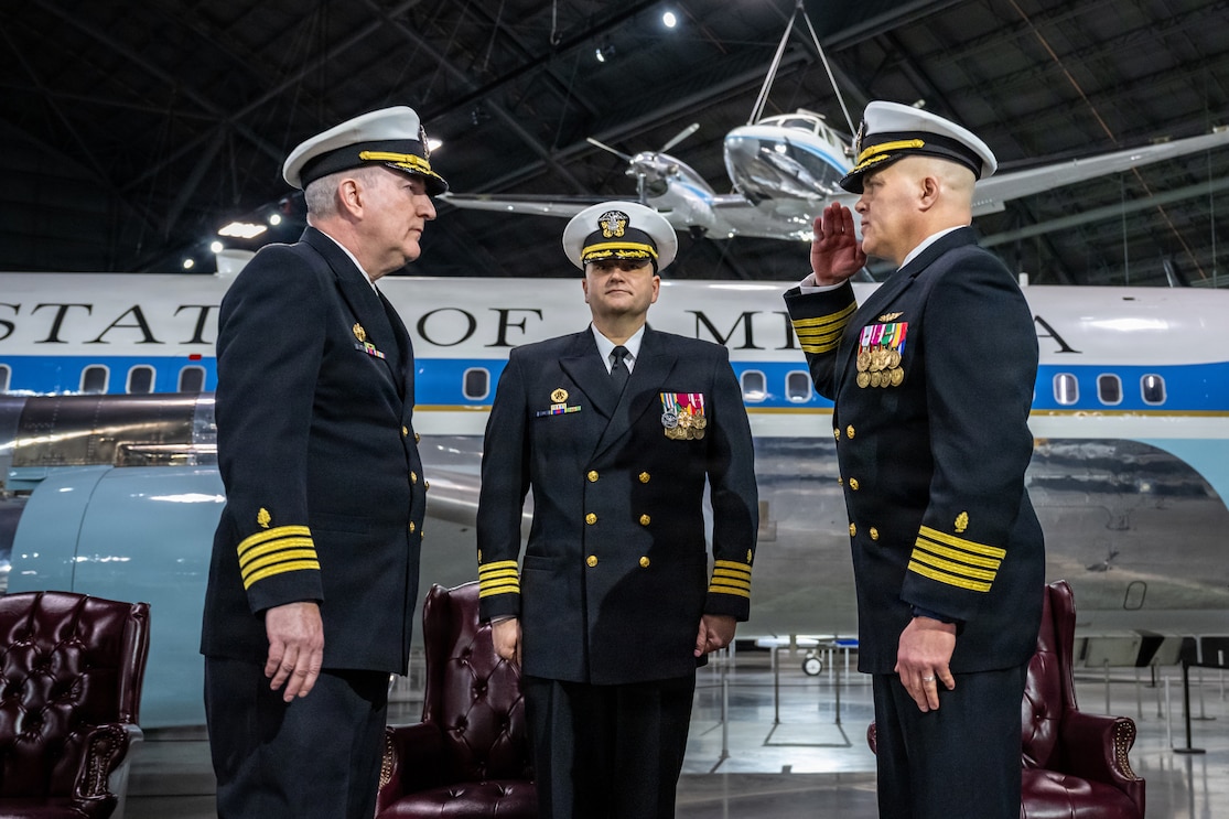 Capt. J. Russell Linderman, Naval Medical Research Unit (NAMRU) Dayton Commanding Officer, takes command from Capt. William Howard during the NAMRU Dayton change of command ceremony April 10, at the National Museum of the U.S. Air Force in Dayton, Ohio. The ceremony was officiated by Capt. Eric Welsh, commander of Naval Medical Research Command (NMRC).