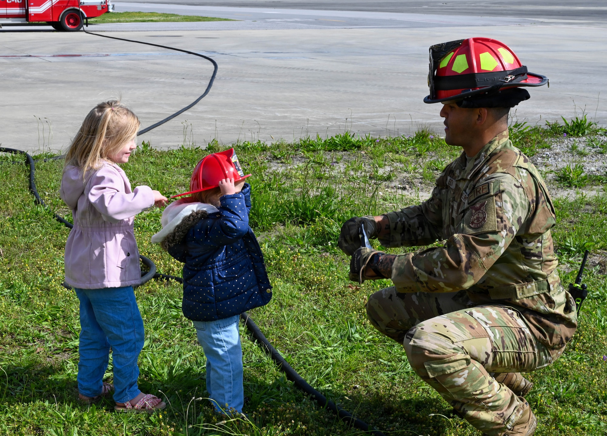 Firefighter talks to children