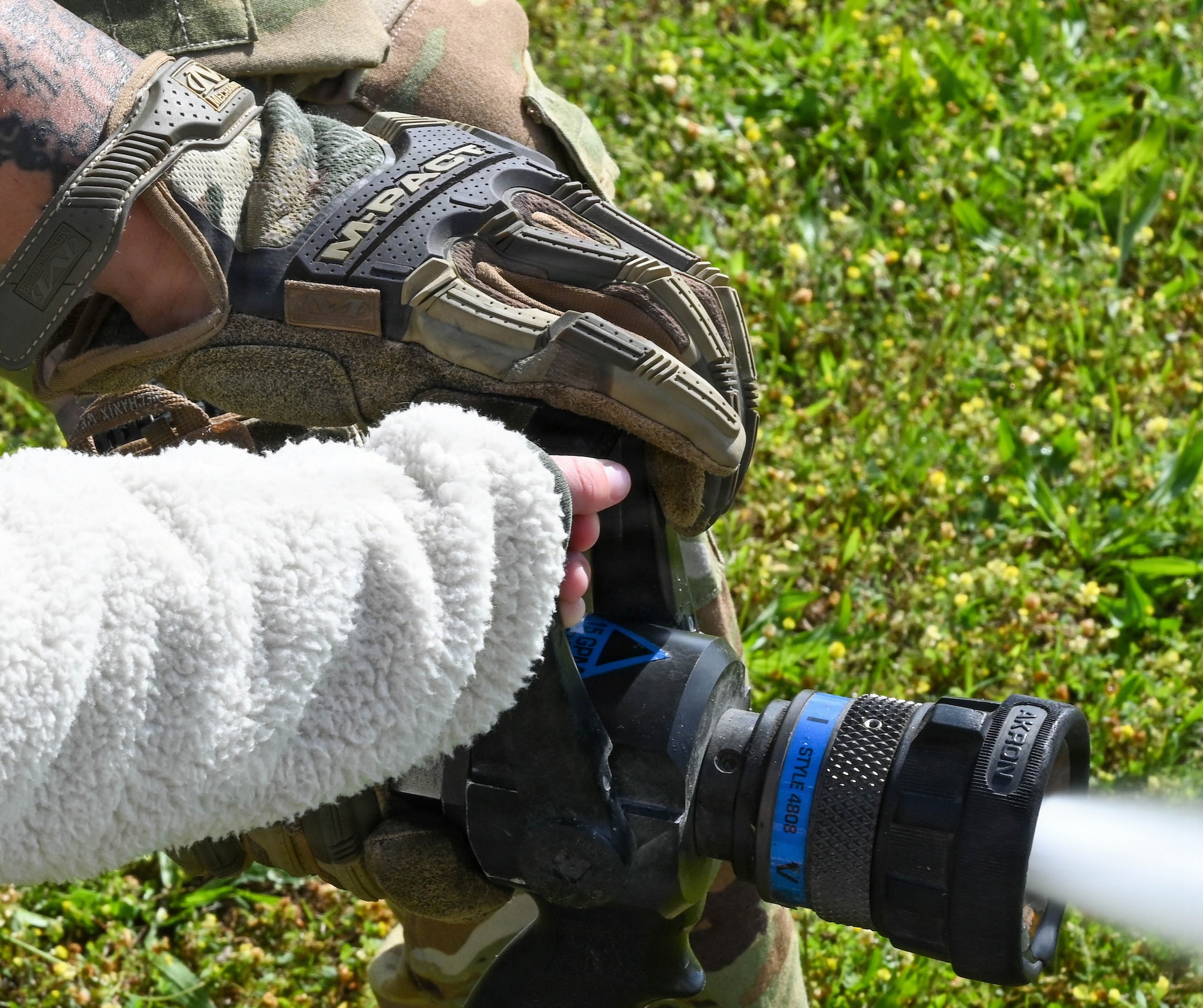 Child uses a fire hose