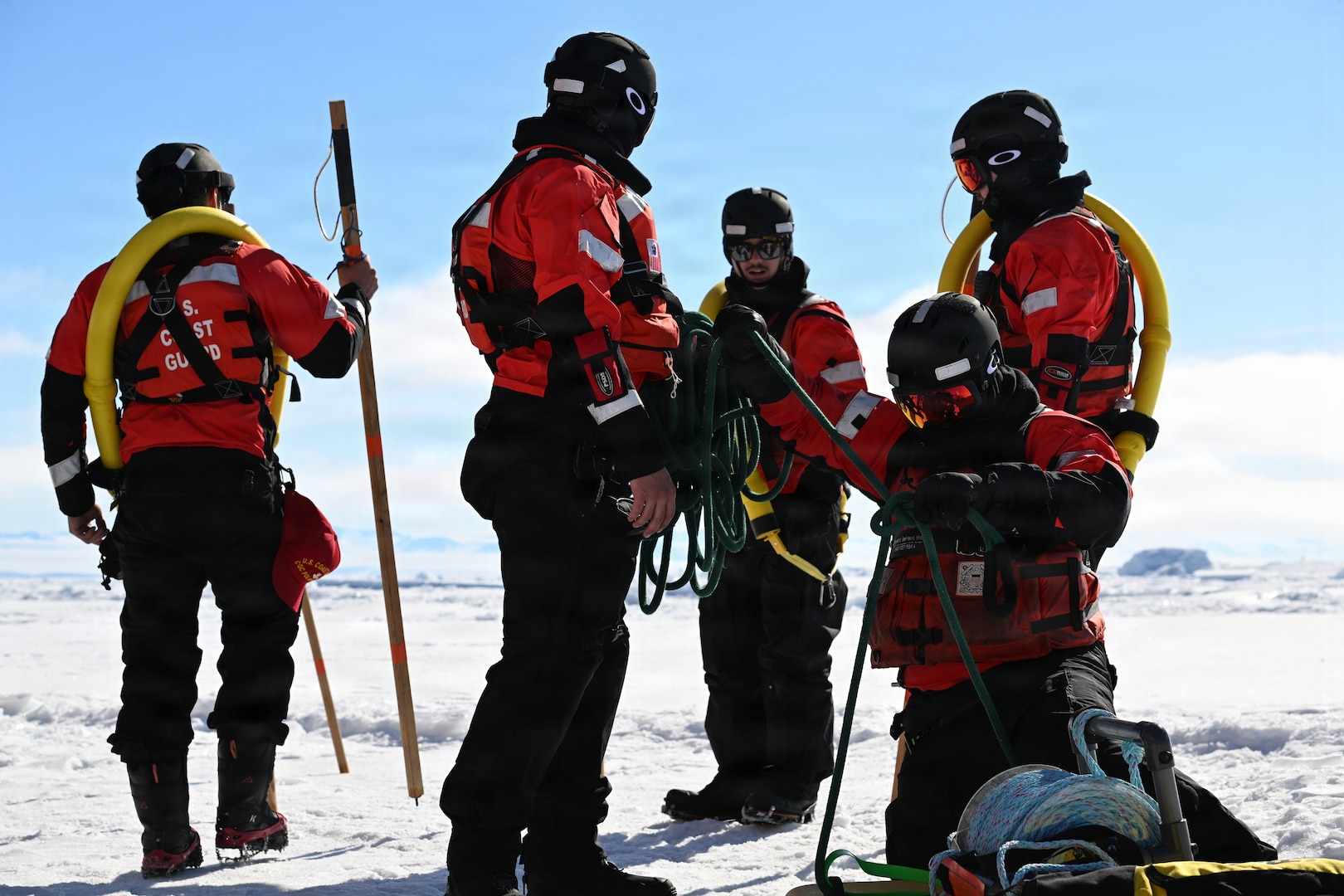 USCGC Polar Star (WAGB 10) ice rescue crew members gather their supplies on the frozen Ross Sea amid Operation Deep Freeze 2026, Jan. 15, 2026.