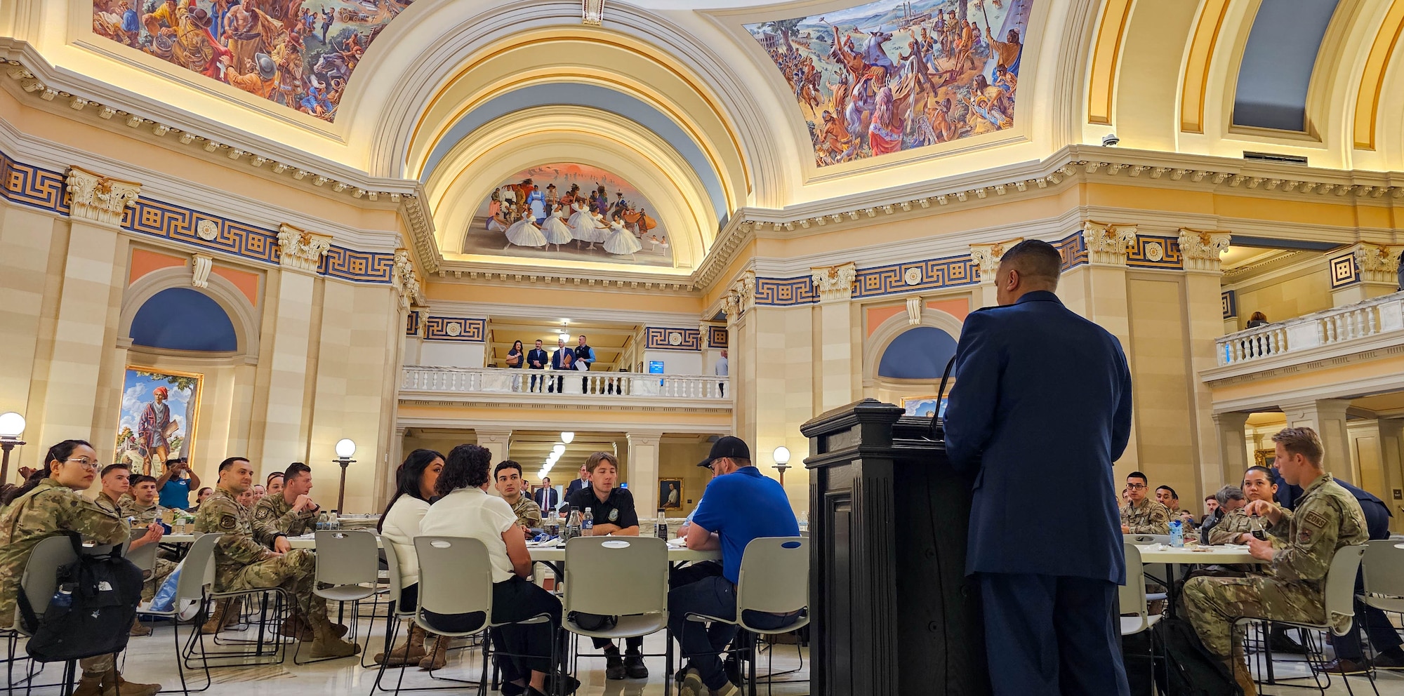 Wide shot showcasing speaker and artwork