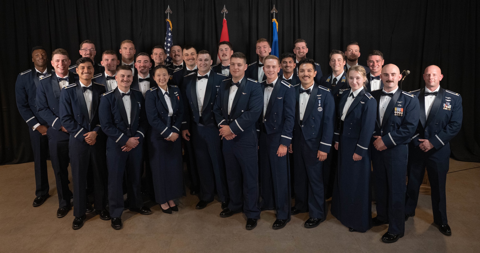 U.S. and Hungarian Air Force officers from graduating Class 26-08 come together for a group photo at Laughlin Air Force Base, Texas, April 9, 2026. Twenty-six U.S. and Hungarian Air Force officers were awarded the coveted silver wings for completing Undergraduate Pilot Training. (U.S. Air Force photo by Airman 1st Class Darryl Keith)