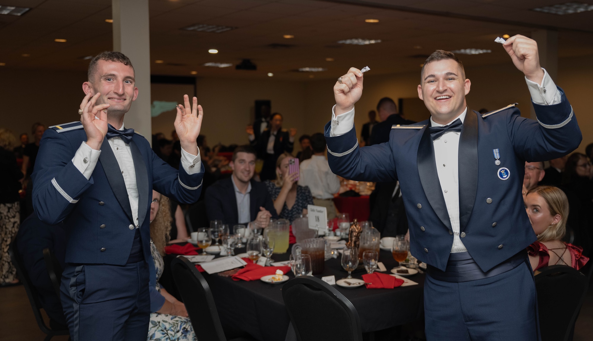 U.S. Air Force Airmen from graduating Class 26-08 break their wings at Laughlin Air Force Base, Texas, April. 9, 2026. Twenty-six U.S. and Hungarian Air Force officers were awarded the coveted silver wings for completing Undergraduate Pilot Training. (U.S. Air Force photo by Airman 1st Class Darryl Keith)