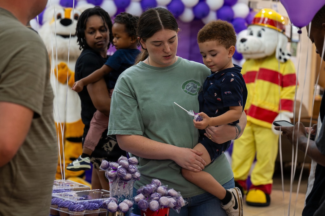 Mother buys her son a treat.