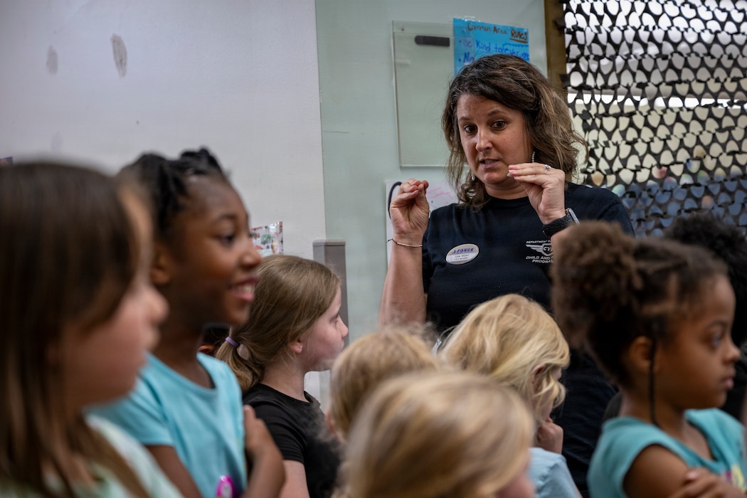 Teacher talking to her students.