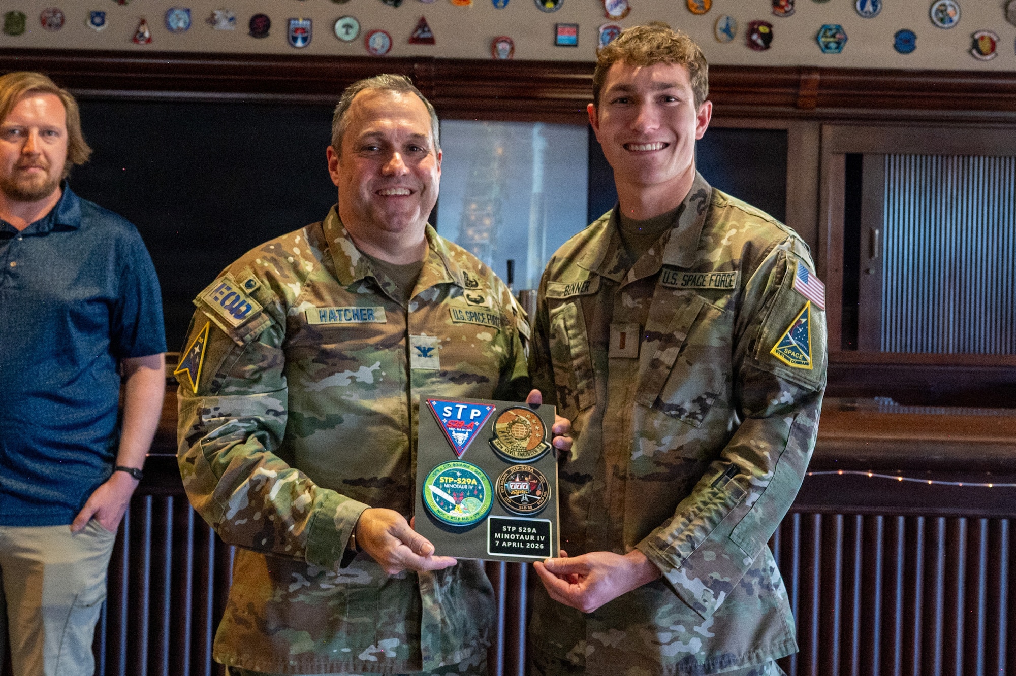 U.S. Space Force Col. Dorian Hatcher and 2nd Lt. Zachery Benner smile for a photo.