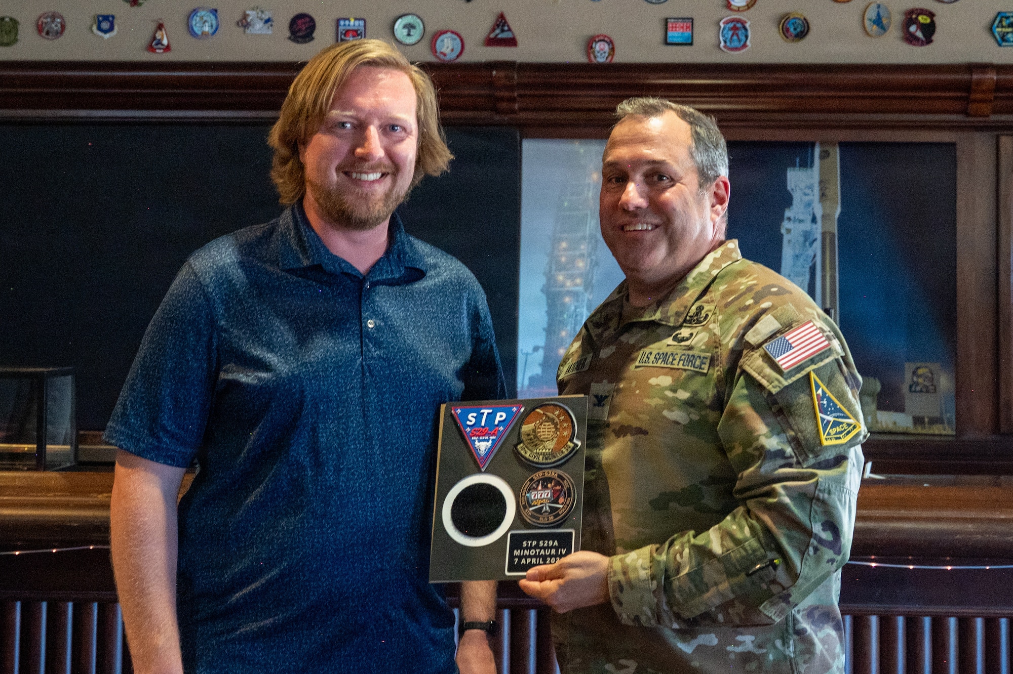 U.S. Space Force Col. Dorian Hatcher and Sean Mussel smile for a photo.