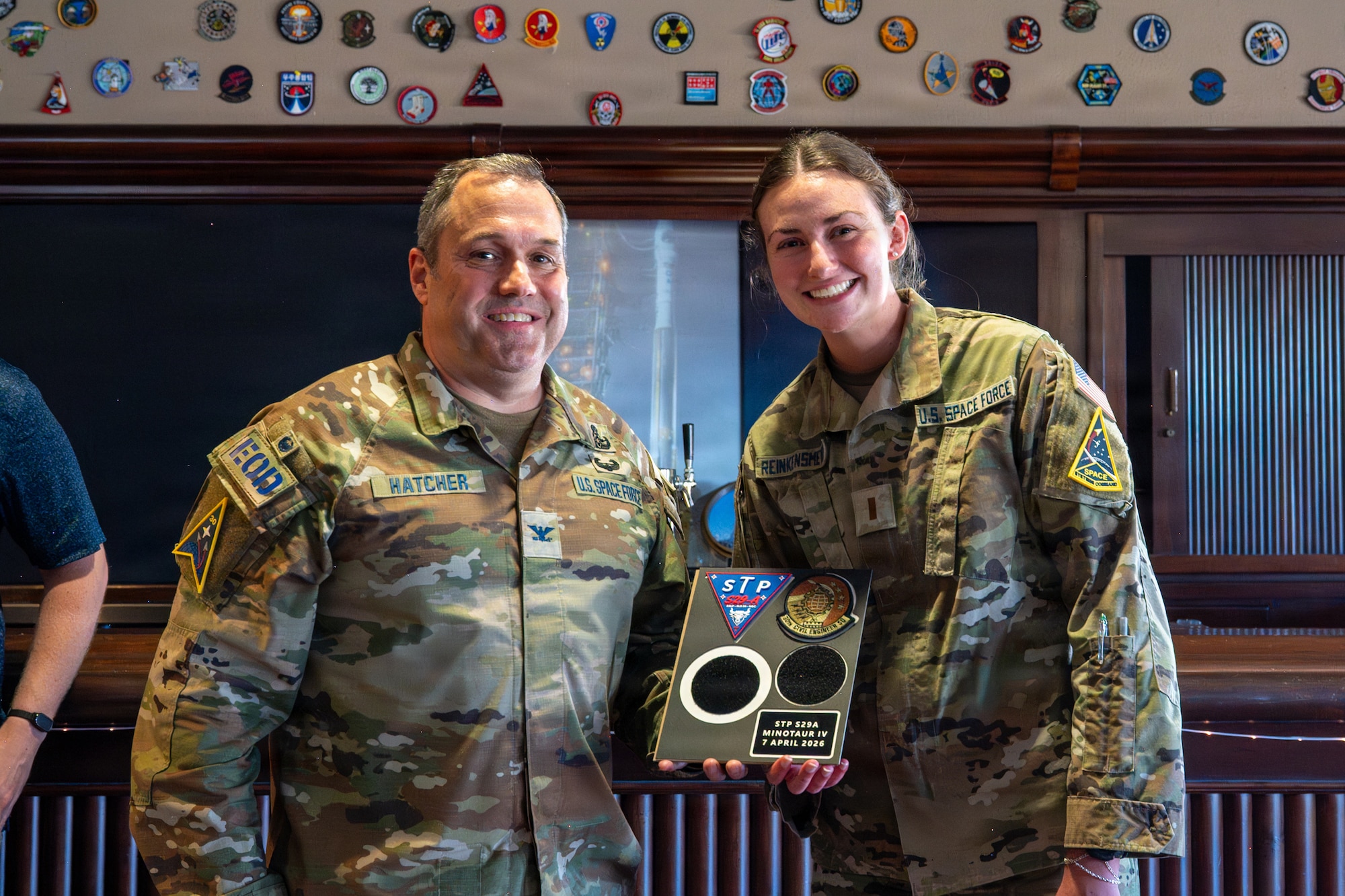 U.S. Space Force Col. Dorian Hatcher and 2nd Lt. Caroline Reinkensmeyer smile for a photo.